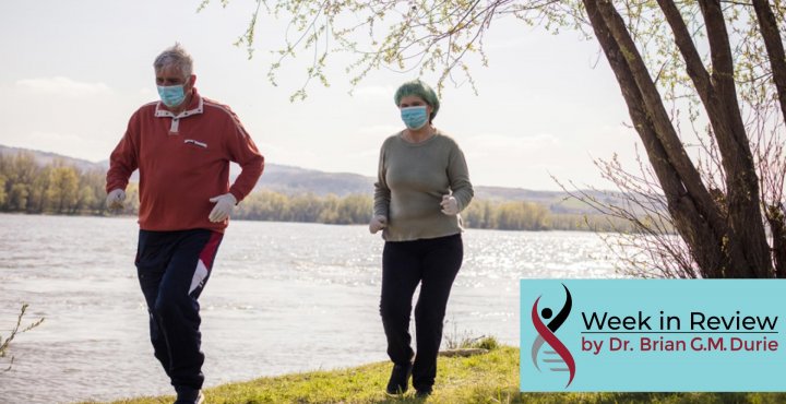 senior couple walking in masks