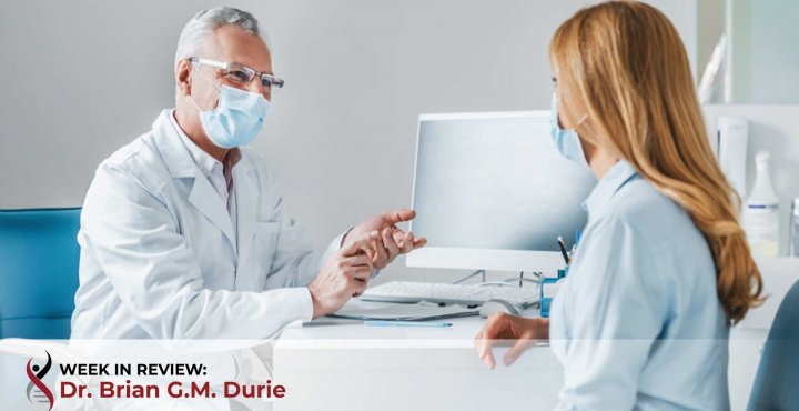 Doctor patient in office with masks on