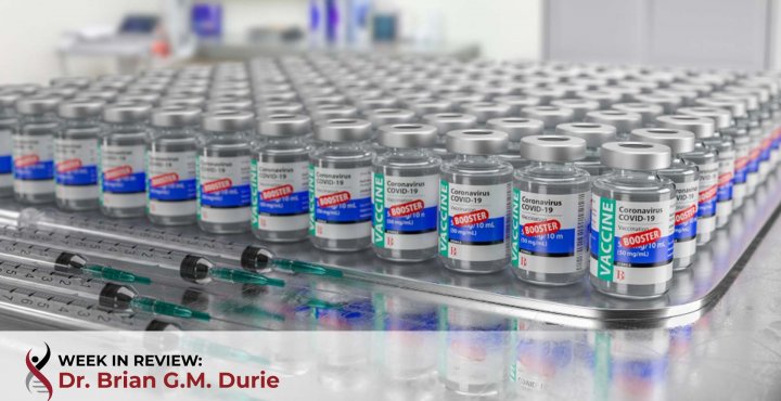 multiple covid 19 vaccine booster vials on table