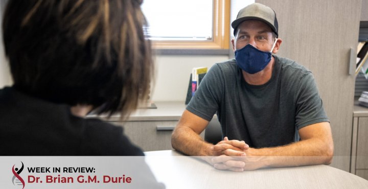 Health care worker with patient in mask