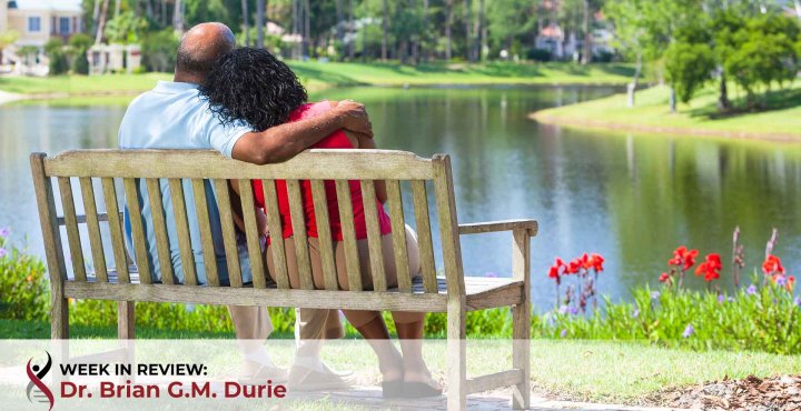 African American couple together on bench
