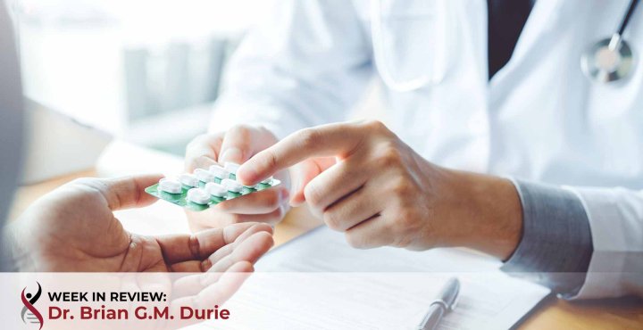 Doctor prescribing pills to patient