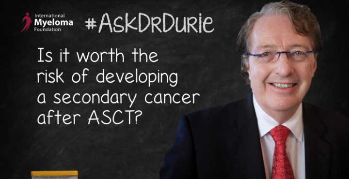 Dr. Durie in front of a chalk board
