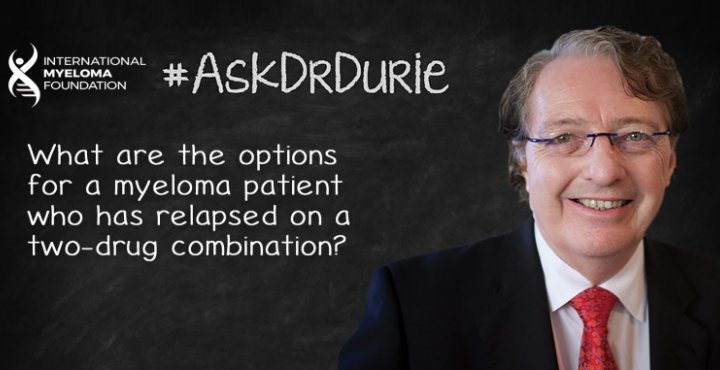 Dr. Durie in front of a chalk board