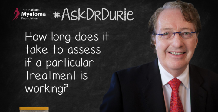 Dr,. Durie in front of a chalk board
