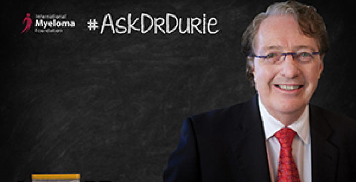 Dr, Durie in front of a chalk board