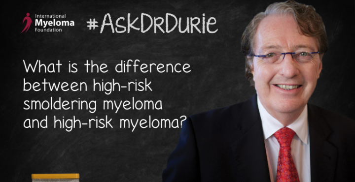 Dr. Durie in front of a chalk board