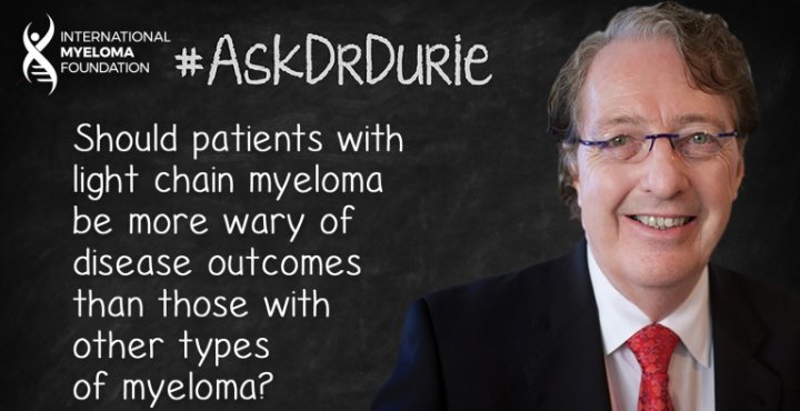 Dr. Durie in front of a chalk board