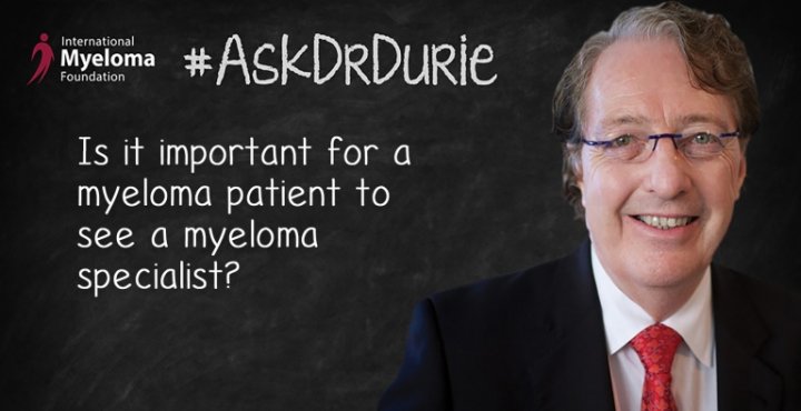 Dr. Durie in front of a chalk board