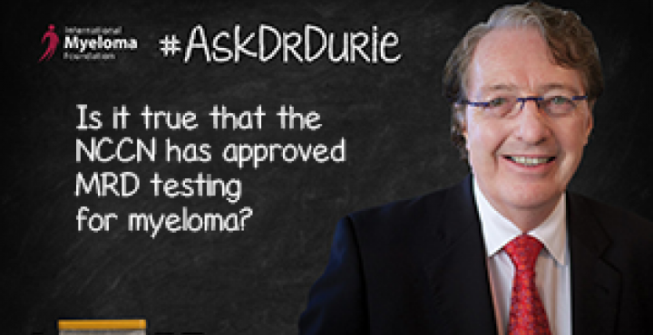 Dr. Durie in fornt of a chalk board