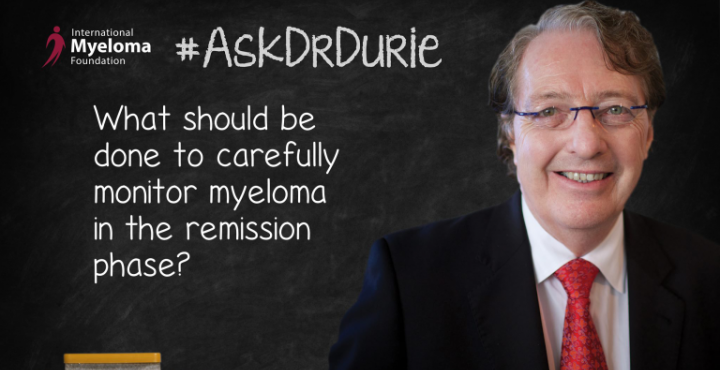 Dr. Durie in front of a chalk board