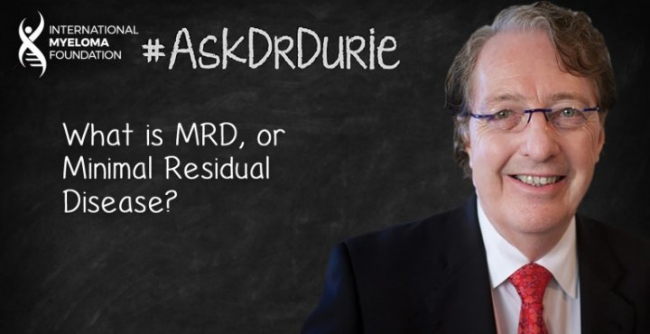 Dr. Durie in front of a chalk board