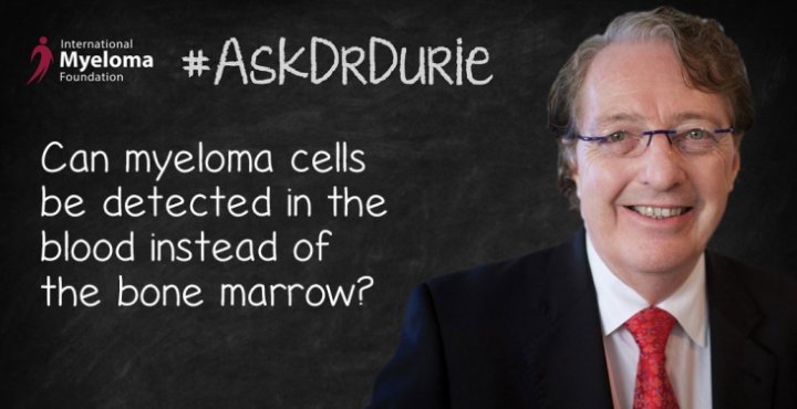 Dr. Durie in front of a chalk board