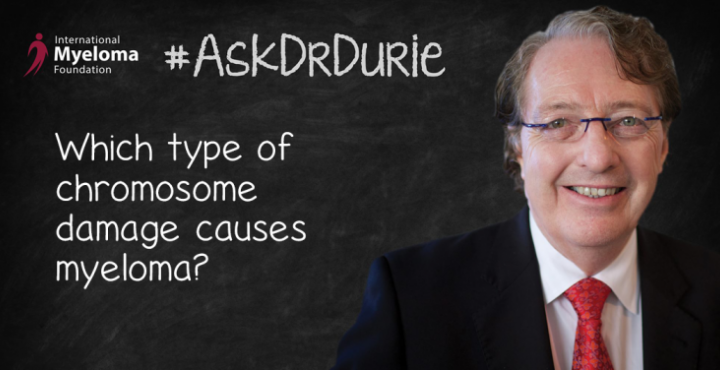 Dr. Durie in front of a chalk board