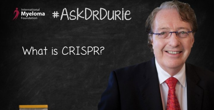 Dr. Durie in front of a chalk board