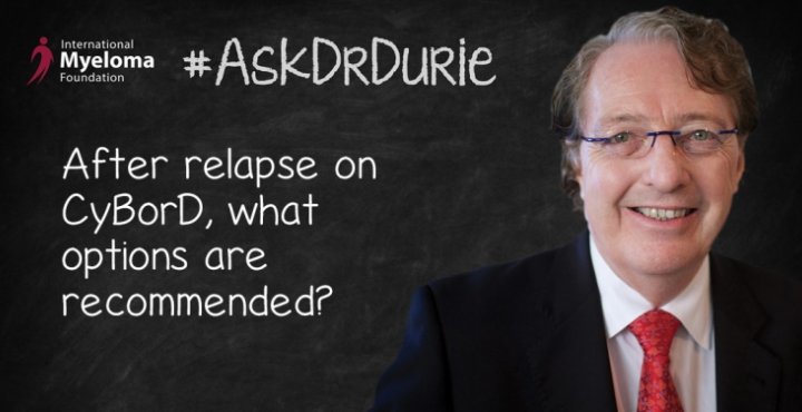 Dr. Durie in front of a chalk board