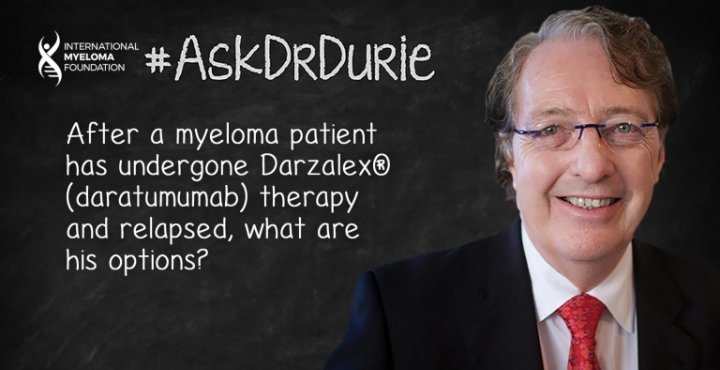 Dr. Durie in front of a chalk board. 