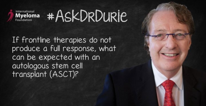 Dr. Durie in front of a chalk board
