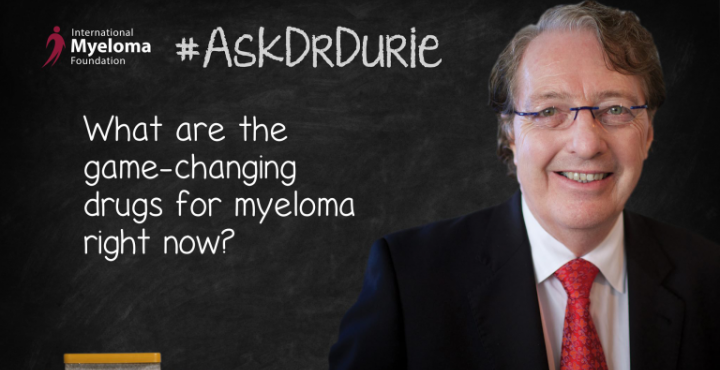 Dr. Durie in front of a chalk board
