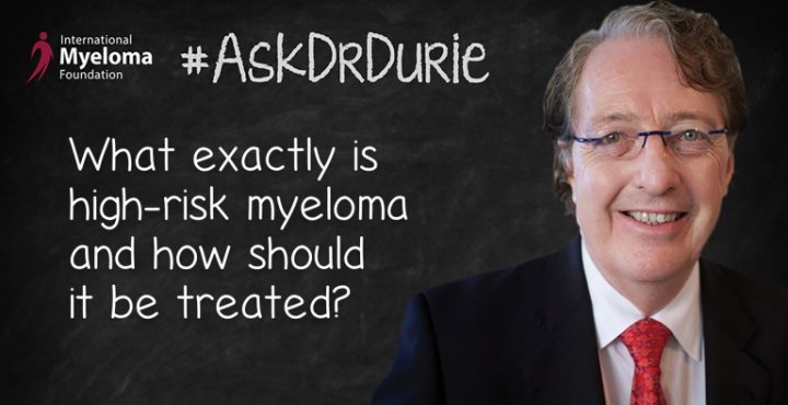Dr. Durie in front of a chalk board
