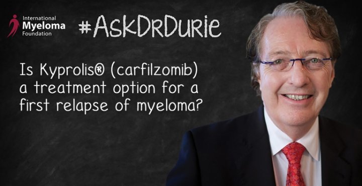 Dr. Durie in front of a chalk board