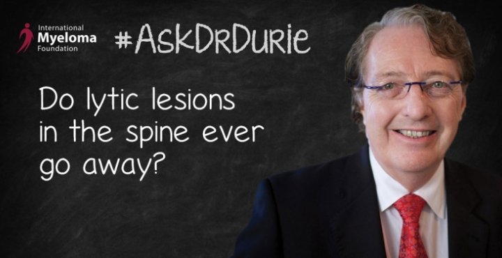 Dr. Durie in front of a chalk board