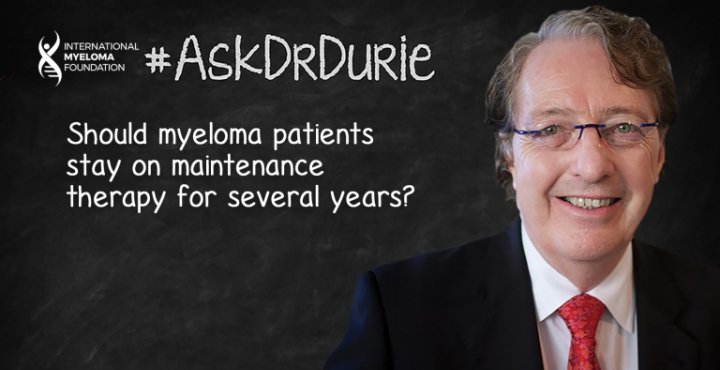 Dr. Durie in front of a chalk board.