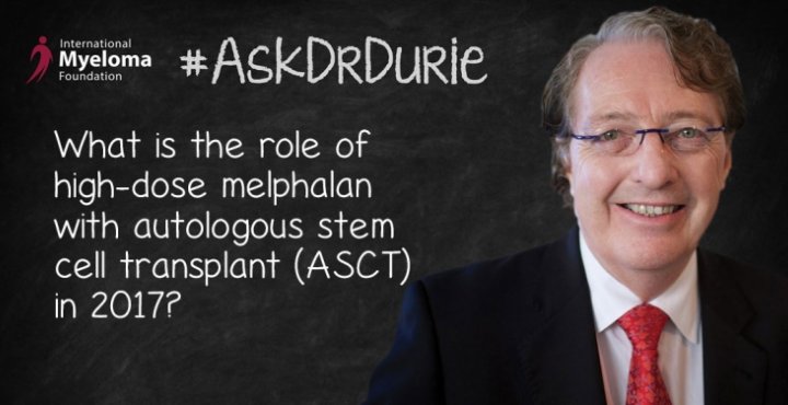 Dr. Durie in front of a chalk board