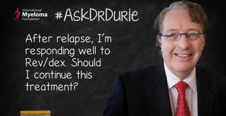 Dr. Durie in front of a chalk board