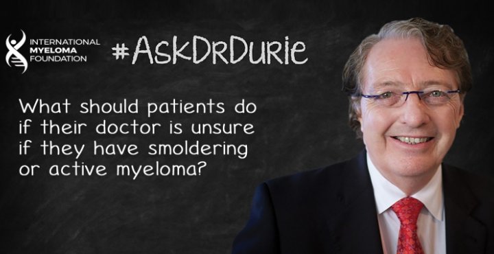 Dr. Durie in front of a chalk board