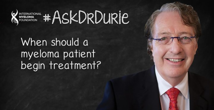 Dr. Durie in front of a chalk board