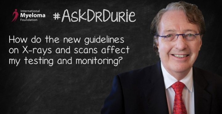 Dr. Durie in front of a chalk board
