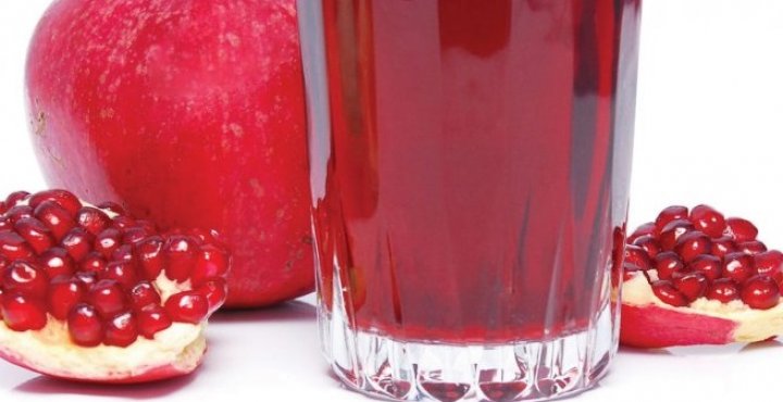 pomegranate with glass of pomegranate juice