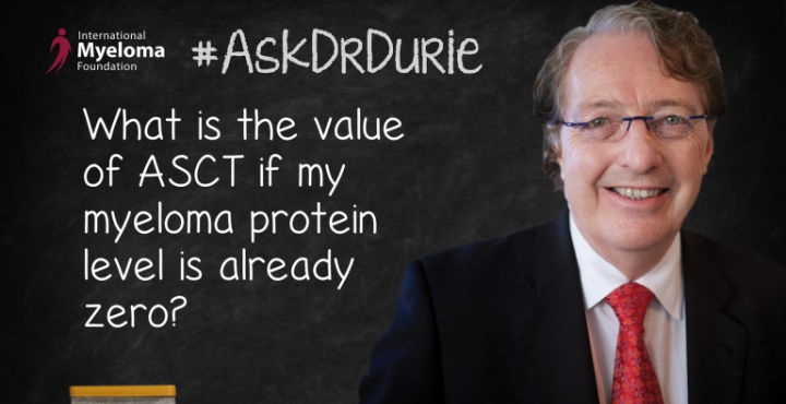 Dr. Durie in front of a chalk board