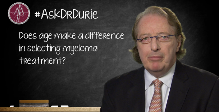 Dr. Durie in front of a chalk board
