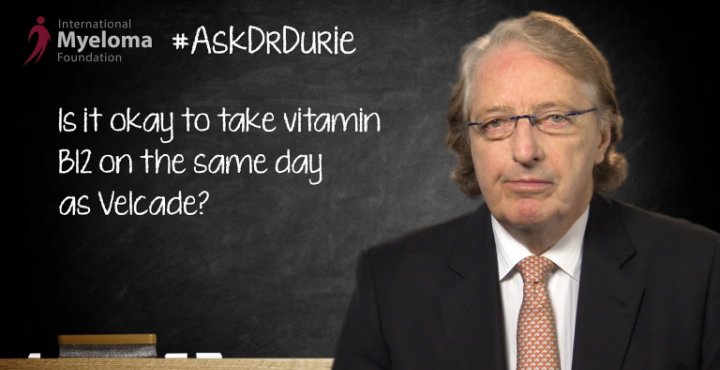 Dr. Durie in front of a chalk board