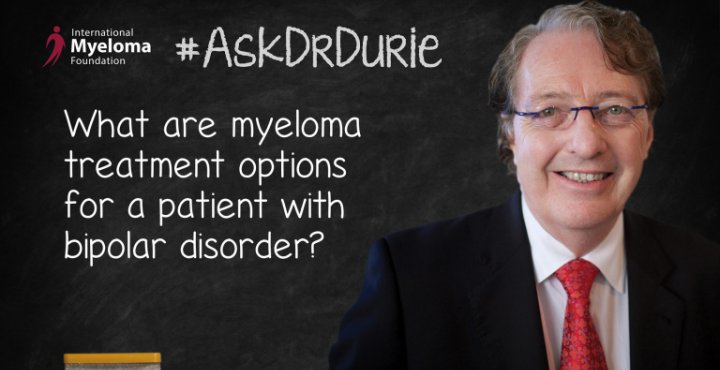 Dr. Durie in front of a chalk board