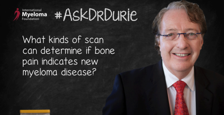Dr. Durie in front of a chalk board