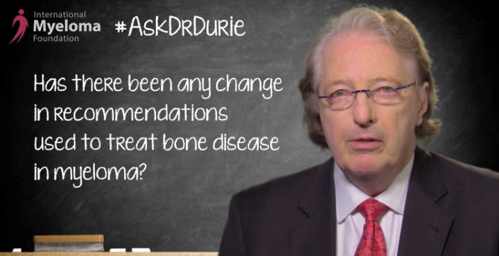 Dr. Durie in front of chalk board