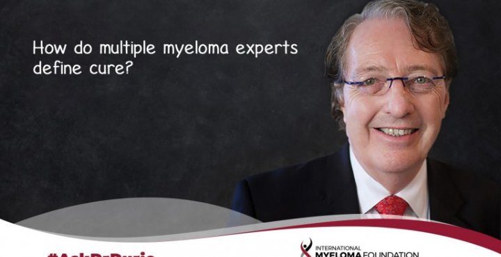 Dr Durie infront of a blackboard with the words how do myeloma experts define cure