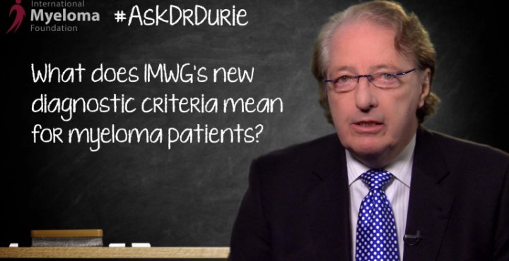 Dr. Durie in front of a chalk board