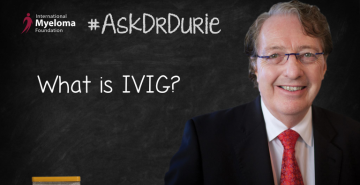 Dr. Durie in front of a chalk board.