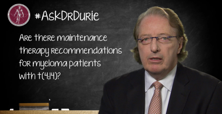 Dr. Durie in front of a chalk board