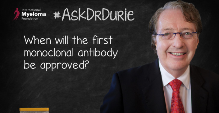 Dr. Durie stands in front of a chalk board. 