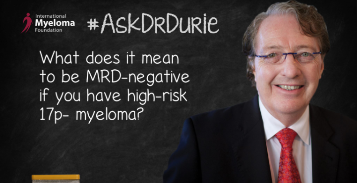 Dr. Durie in front of a chalk board