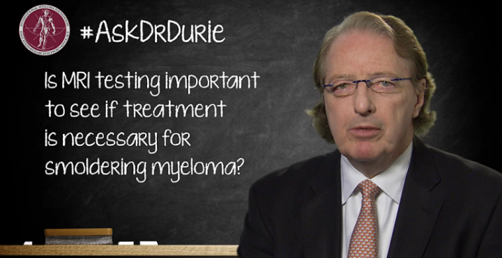 Dr. Durie in front of chalk board