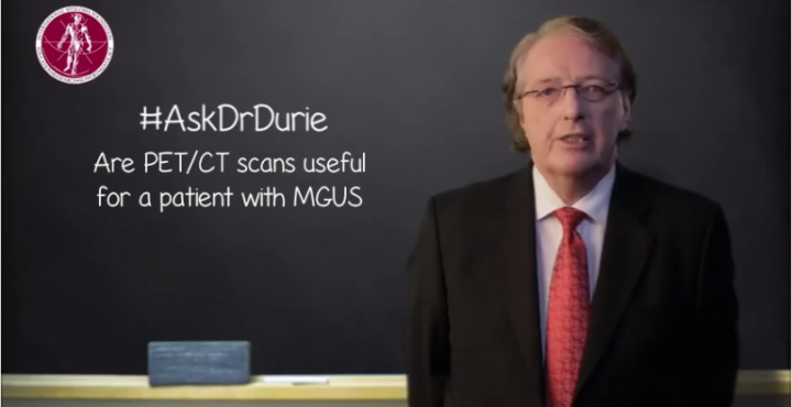 Dr. Durie in front of a chalk board