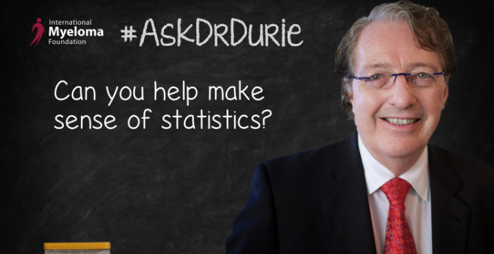 Dr.Durie in front of a chalk board