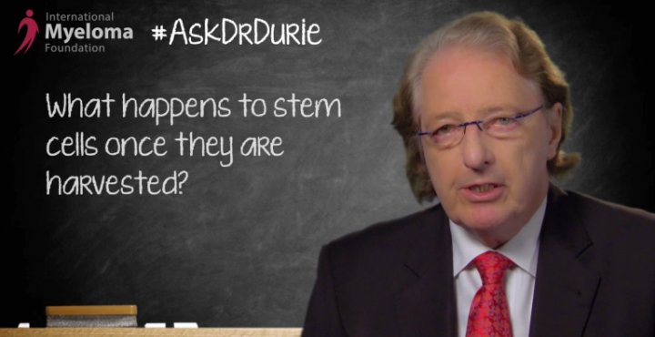 Dr. Durie in front of a chalk board