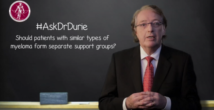 Dr. Durie in front of chalk board